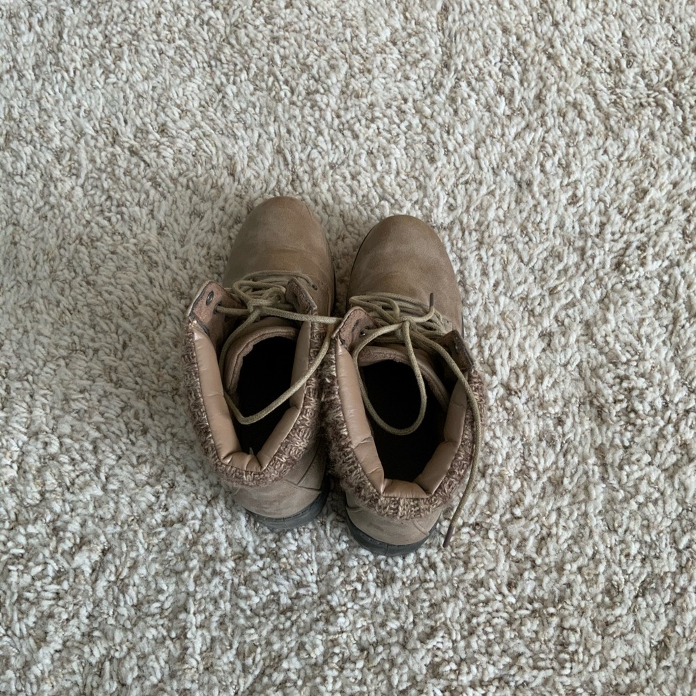Brown lace up boots.